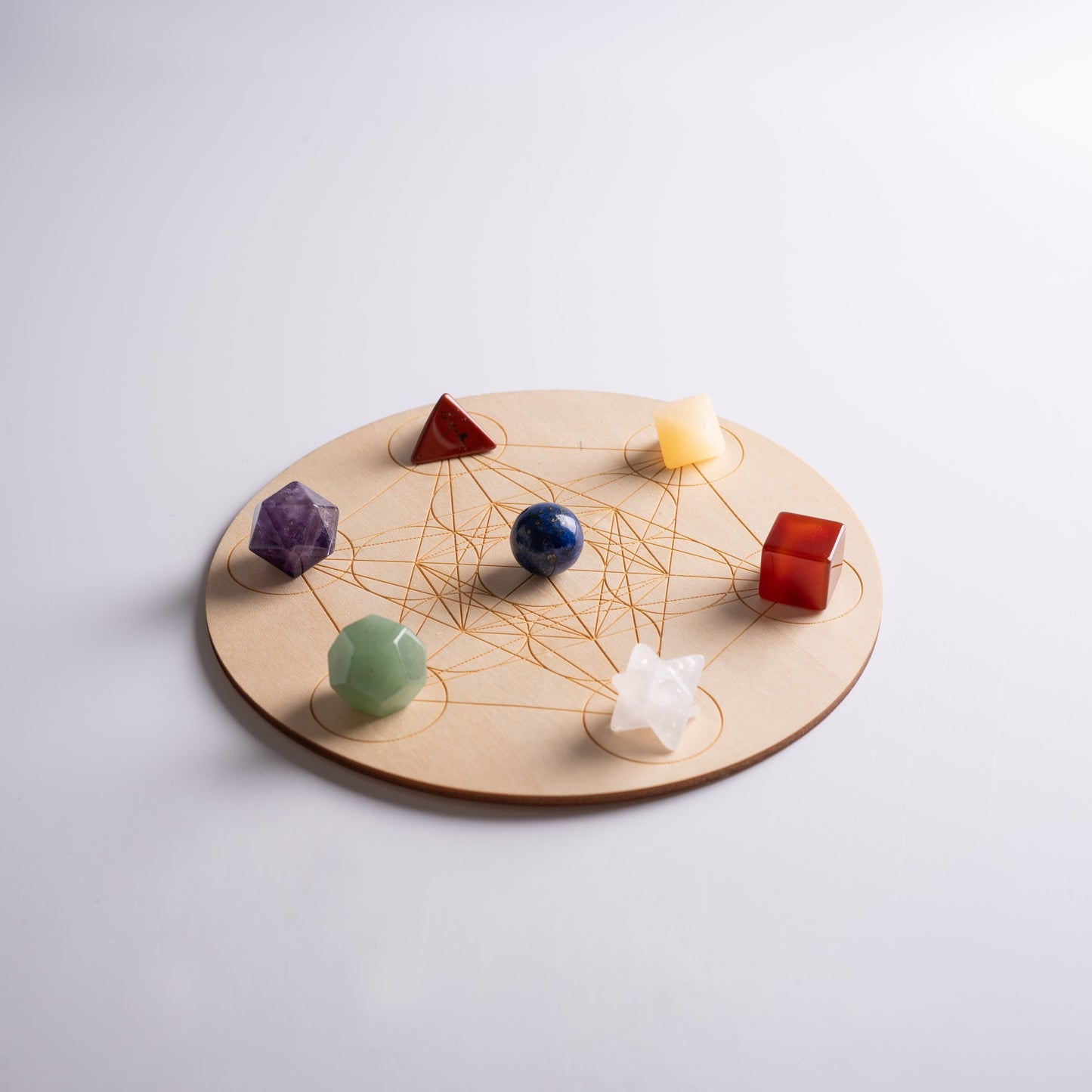 Chakra healing stones set placed on altar for meditation and spiritual rituals.