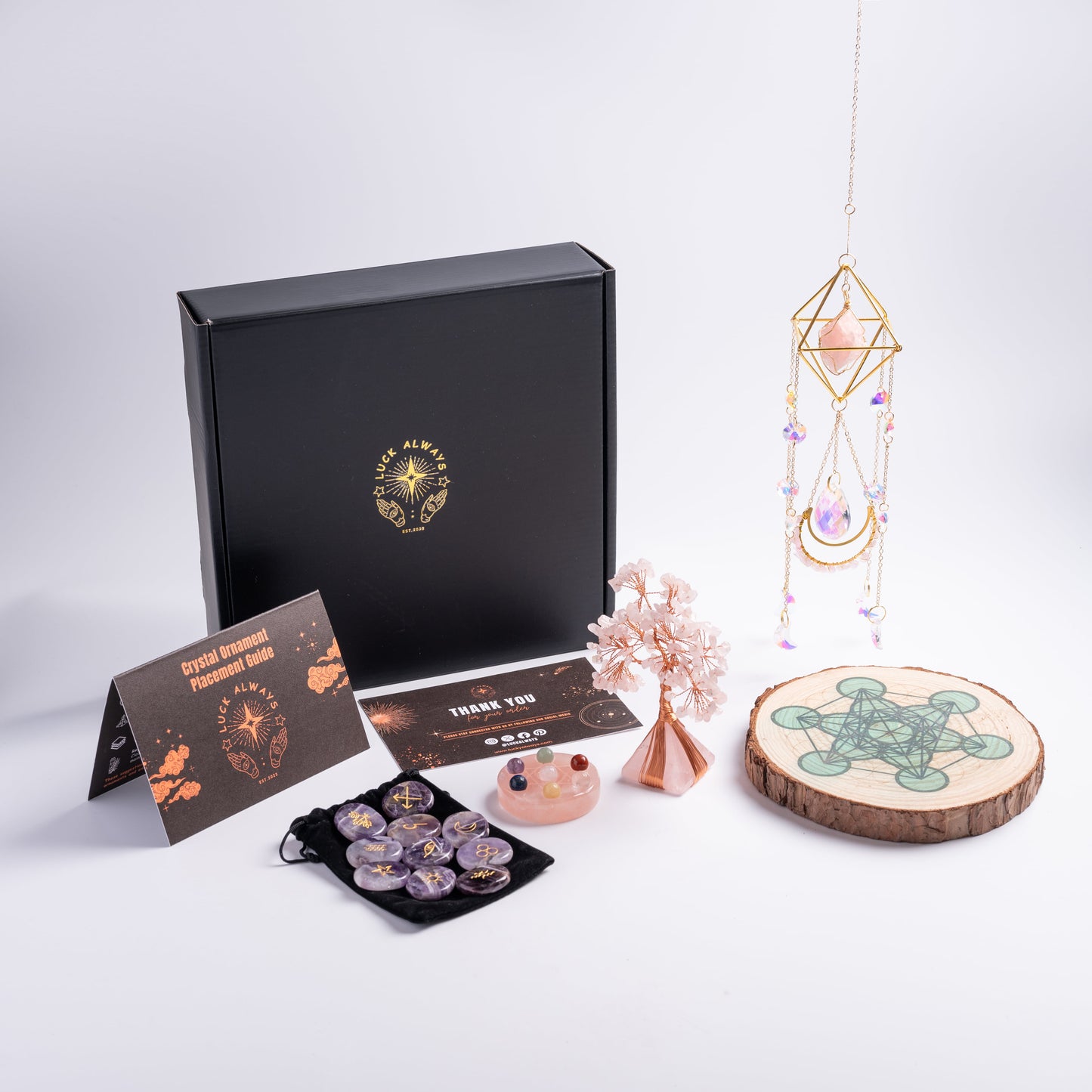Chakra stones and crystal set for love, joy, and harmony with sacred elements.