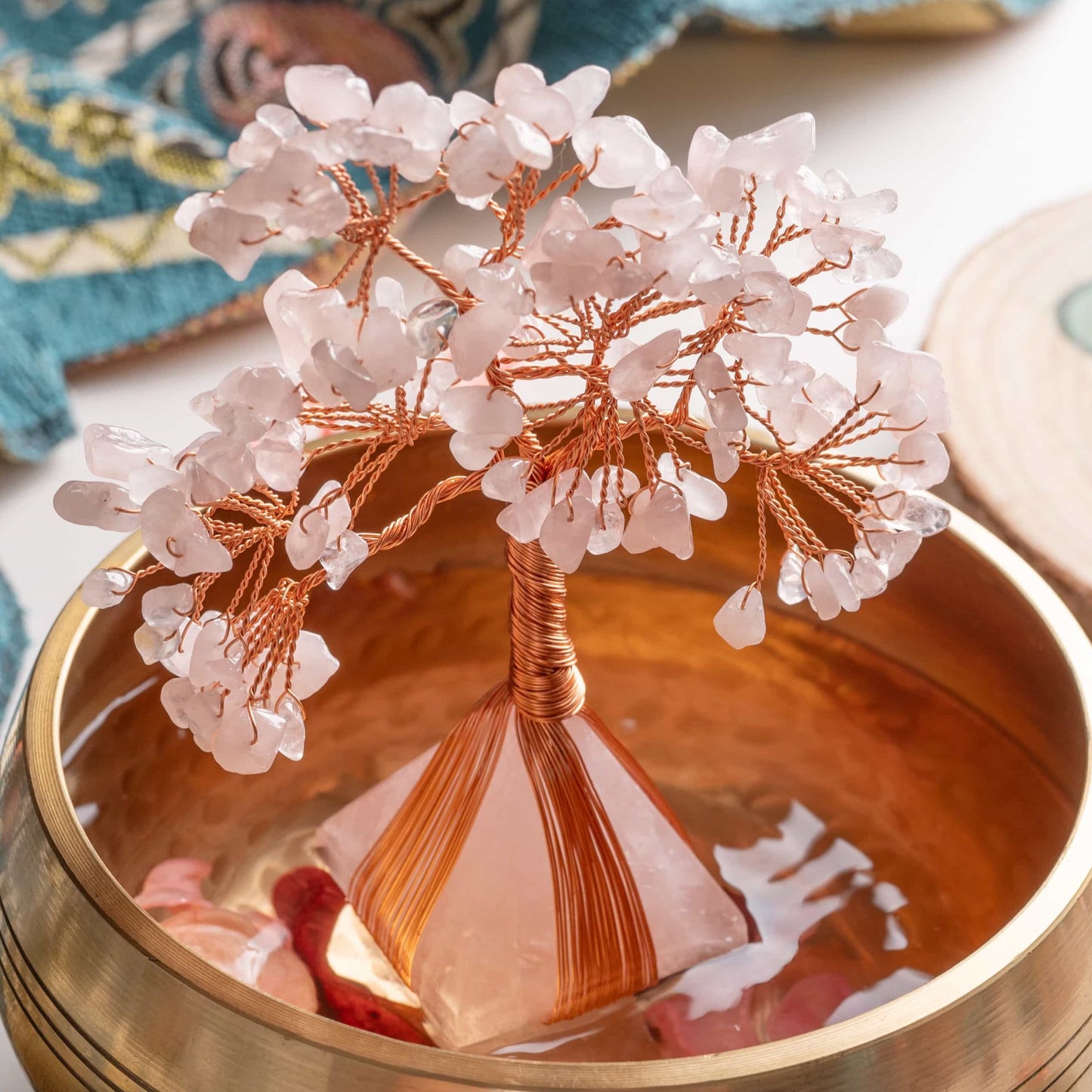 Close-up of gemstone branches and crystals on bonsai tree of life, symbolizing emotional harmony and abundance.