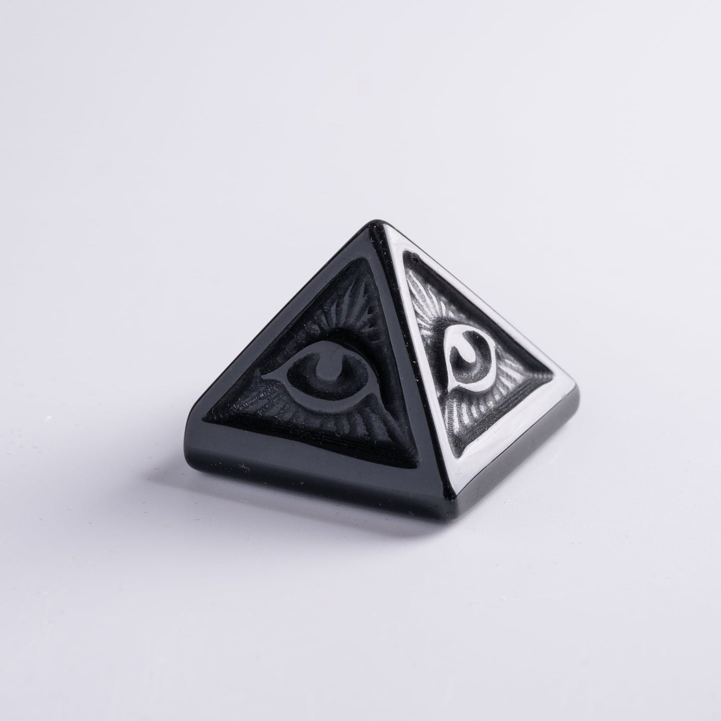 Evil eye with pyramid placed on altar, radiating spiritual energy and protection.