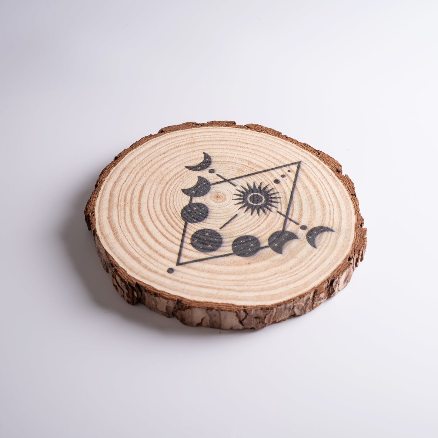Lunar energy crystal grid with Moon Phases design, used for manifestation and healing.