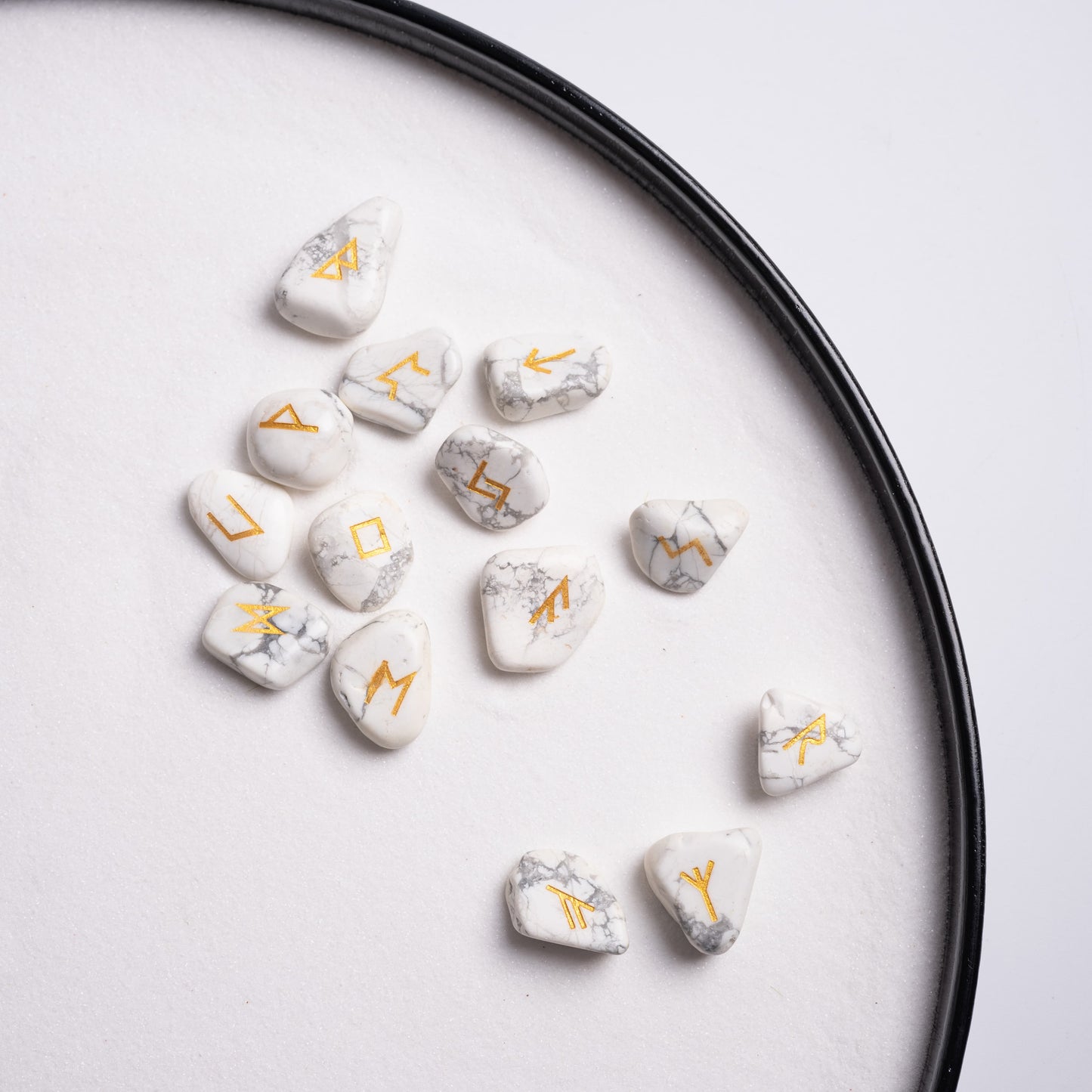 Mystic crystal runes set of 25 white turquoise stones with golden symbols.
