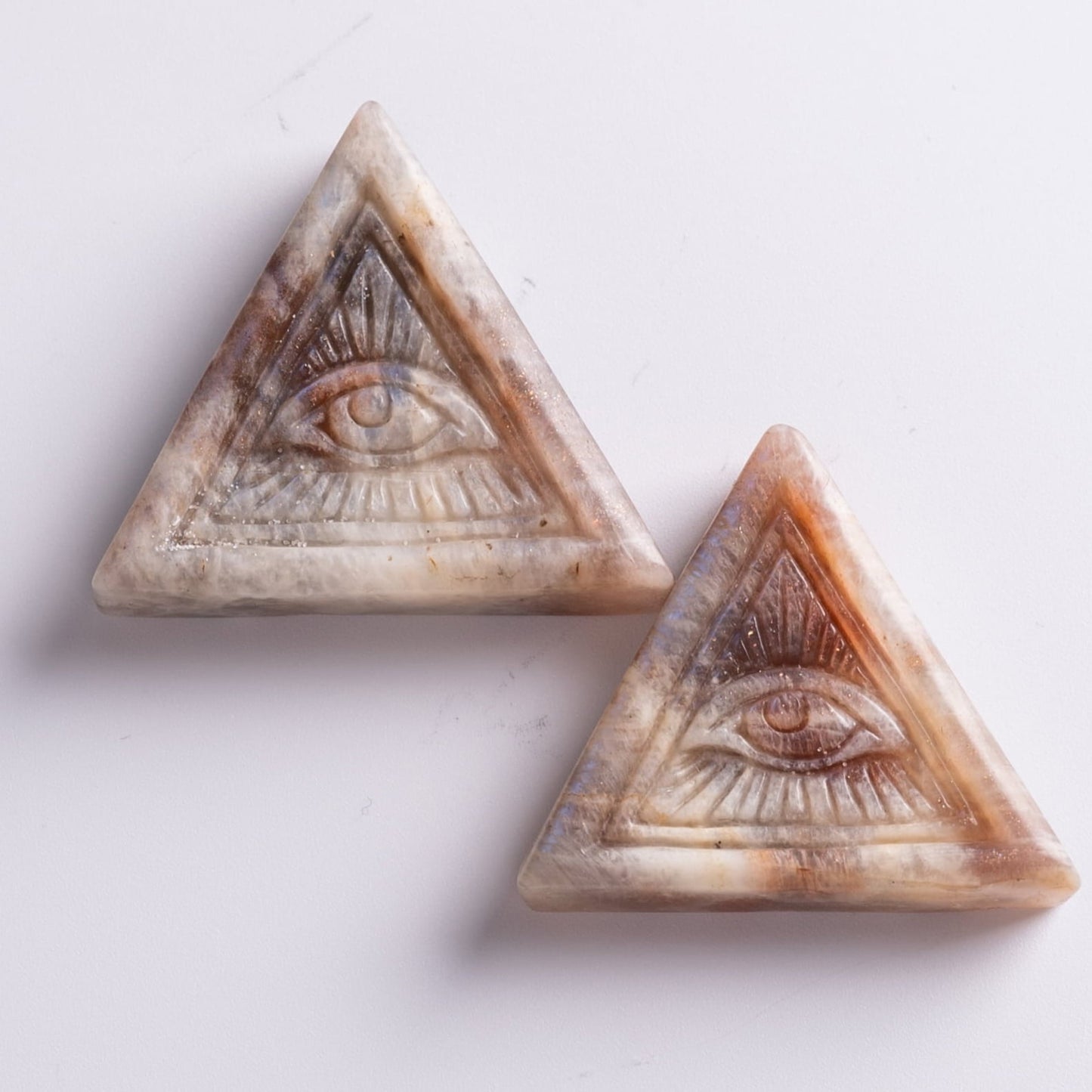 Natural moonstone Eye of Horus amulet, enhancing clarity and mental strength.