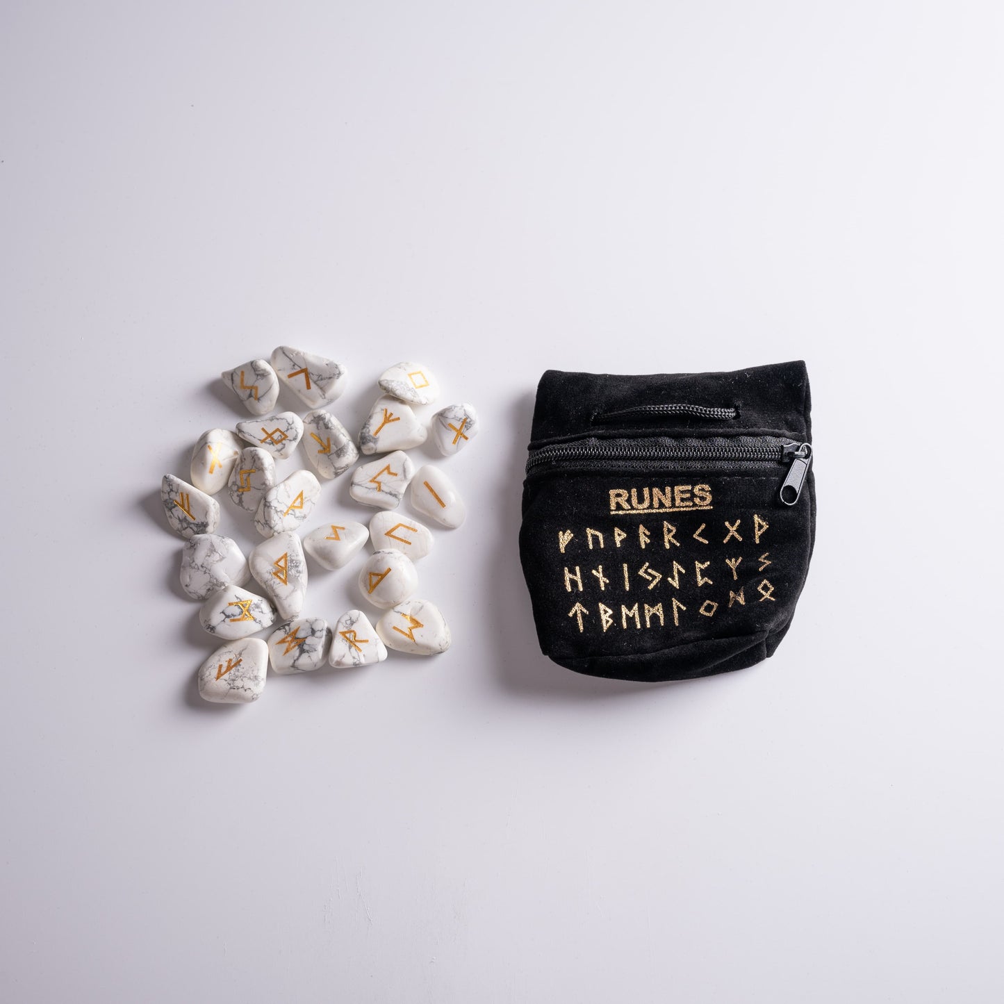 Rune with runes in luxurious black velvet bag, ready for spiritual rituals.