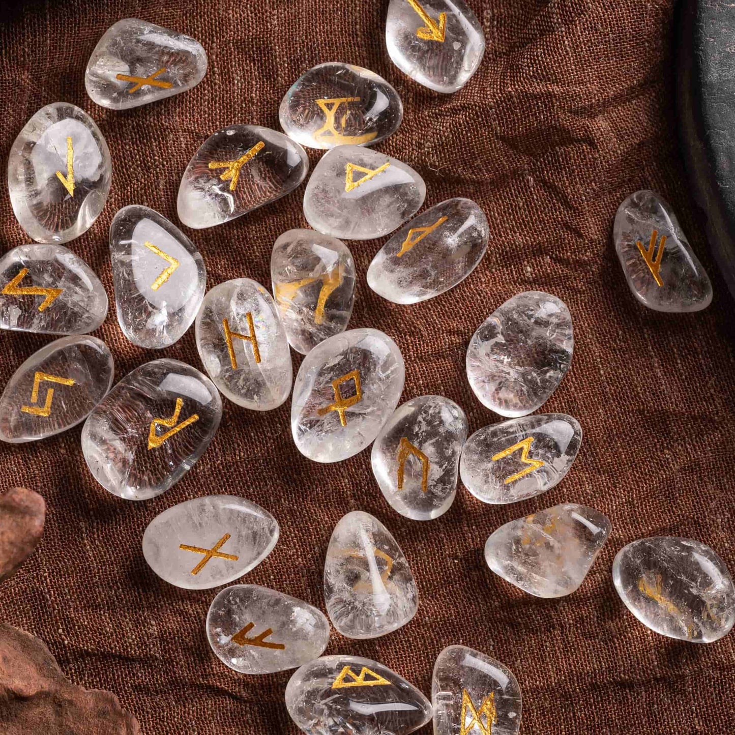 Close-up of hand-engraved mystic crystal runes with ancient symbols.
