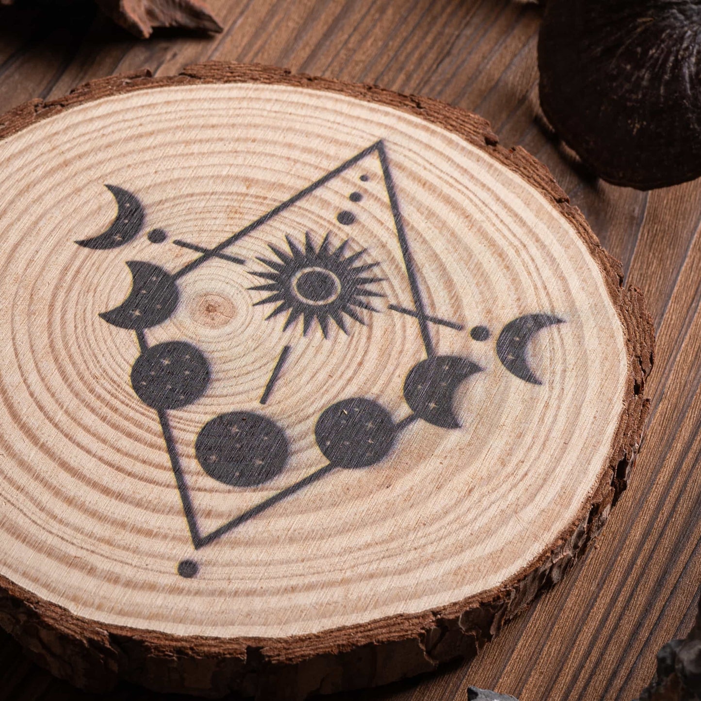 Close-up of sacred geometry Moon Cycle crystal grid, featuring lunar symbols.