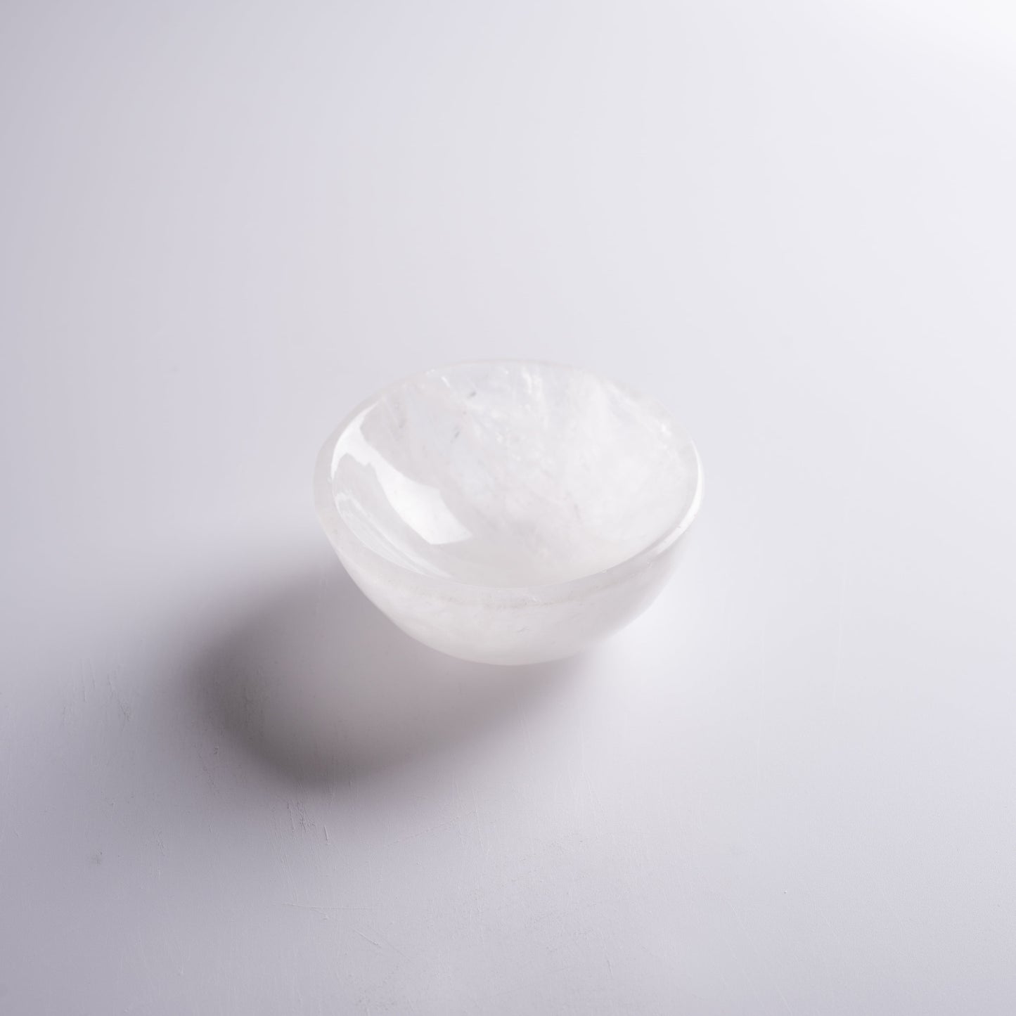 Small crystal bowl displayed in sacred space, used for rituals and offerings.