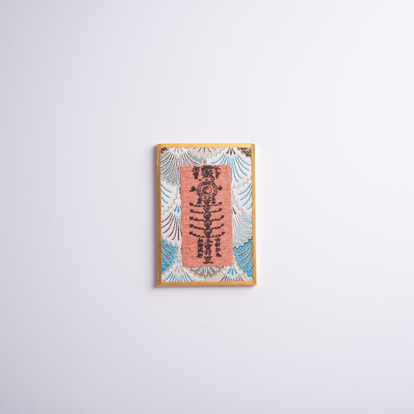 Talisman hope charm placed on altar for meditation and spiritual protection.