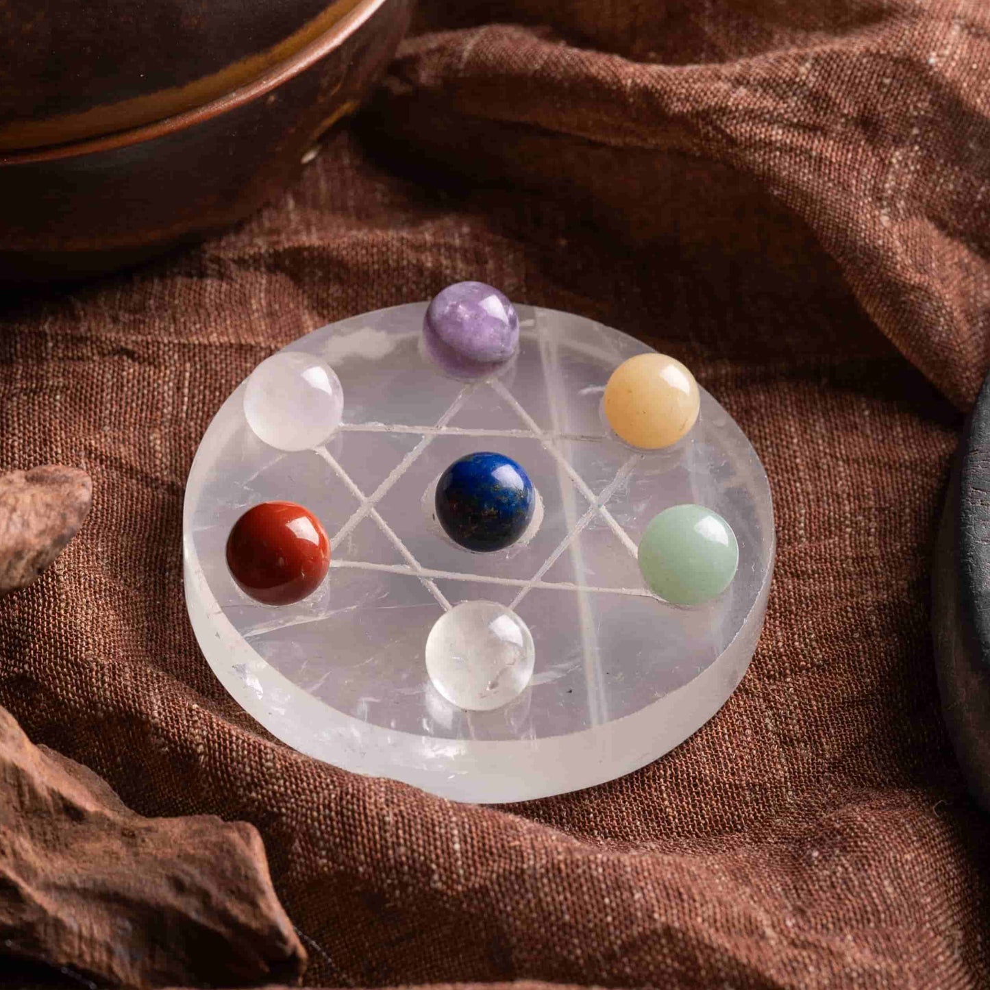 7 chakra stones set with hexagram stand for healing and energy balance.
