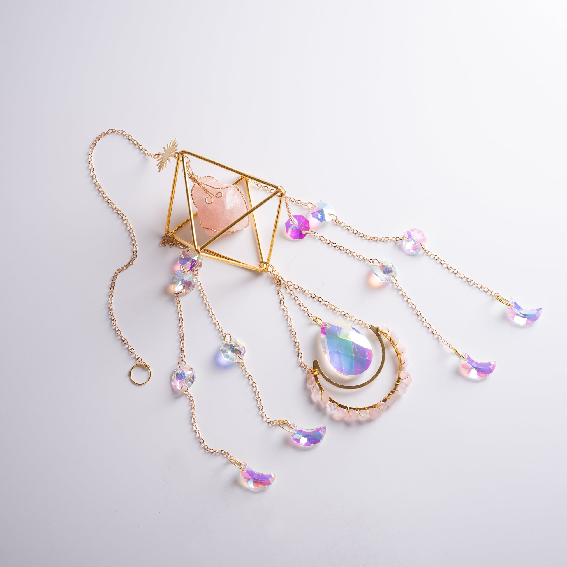 Hanging crystal suncatcher in meditation corner radiating joy and harmony.