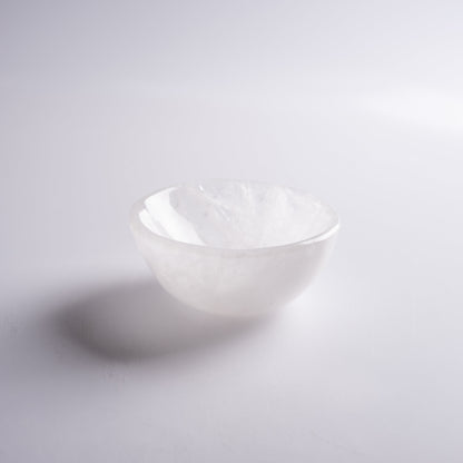Charging crystal bowl for cleansing and energizing stones, perfect for meditation.