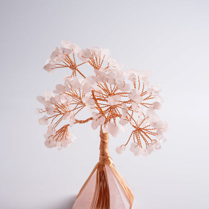 Crystal money tree placed on desk, attracting positive energy, love, and good fortune in feng shui practice.