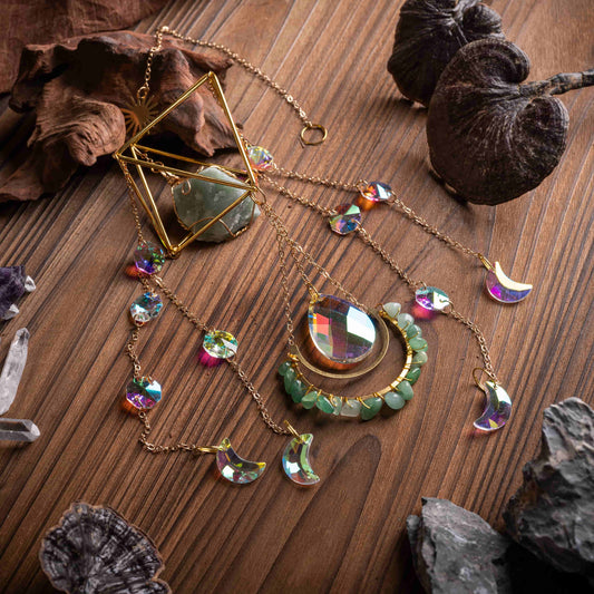 Crystal sun catcher with aurora crystals, moon gemstones, and copper chain.