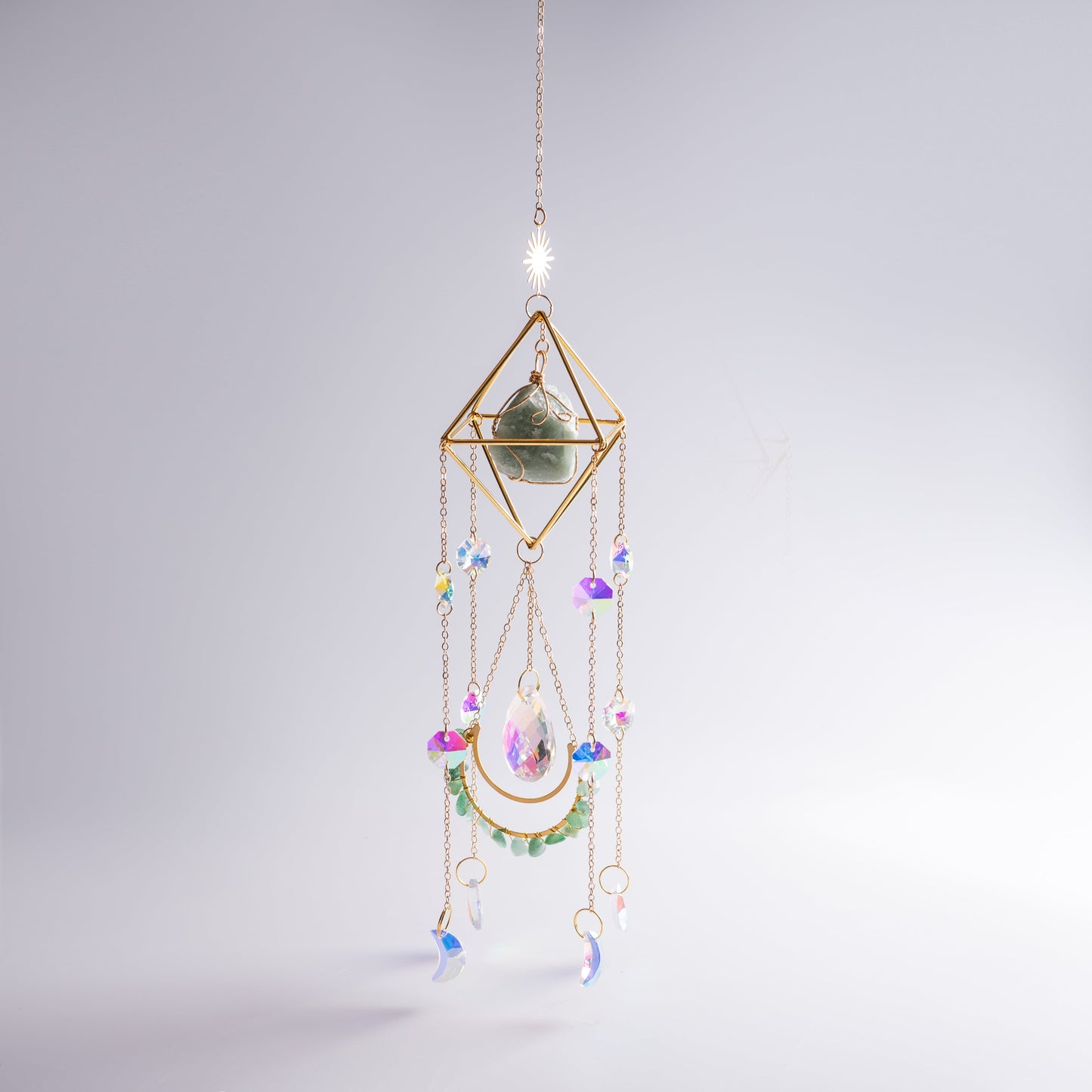 Hanging crystal suncatcher detail showing shimmering crystals and moonstone.