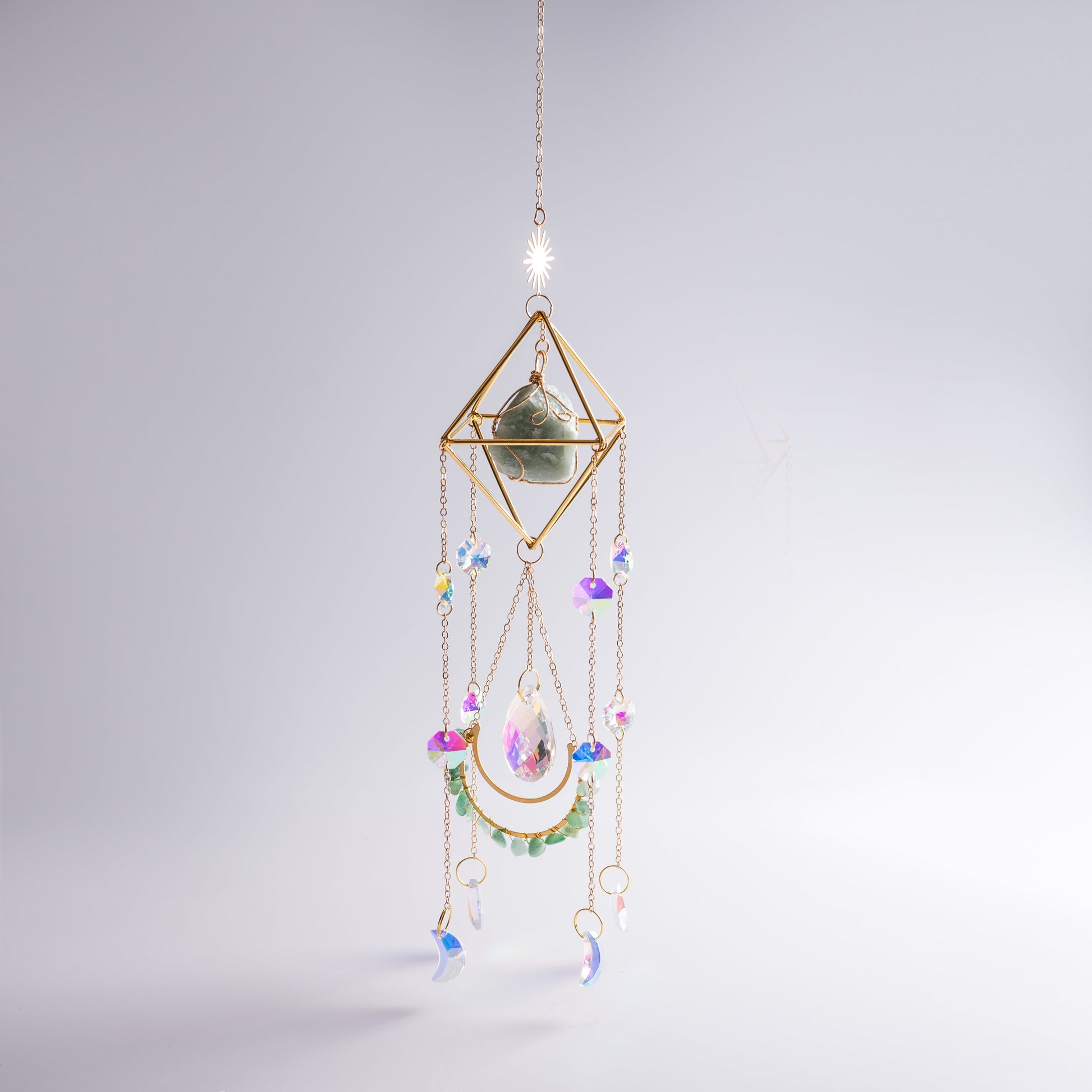 Hanging crystal suncatcher detail showing shimmering crystals and moonstone.