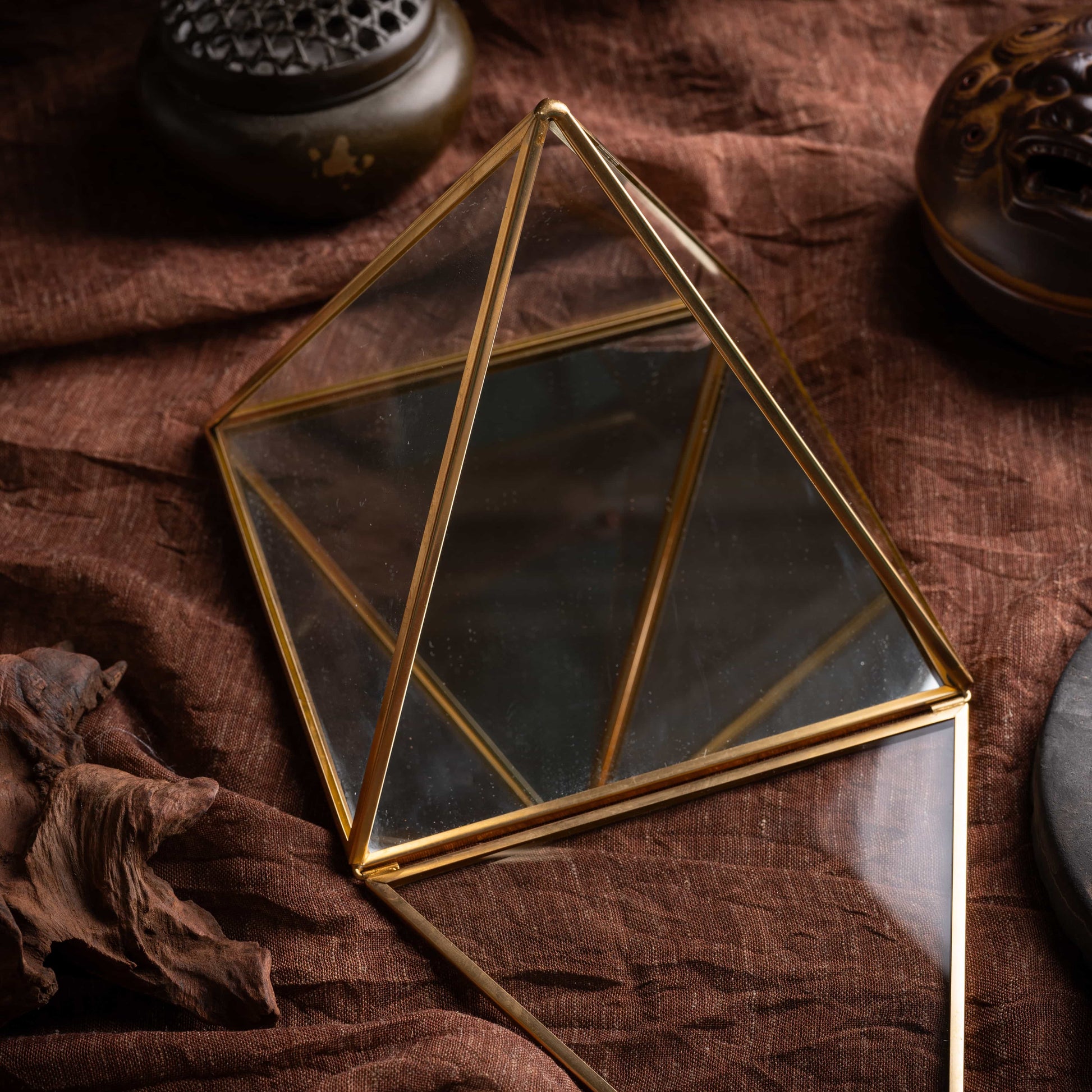 Lucky brass pyramid charging box with clear glass surface for energy work.