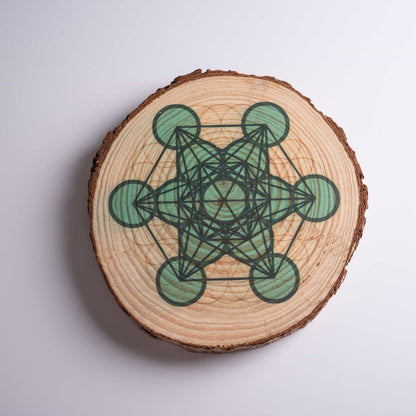 Close-up of laser-engraved Metatron's Cube art on crystal grid board for healing.