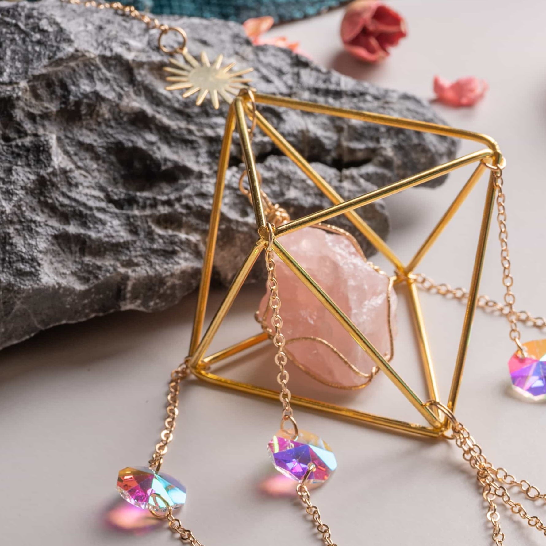 Close-up of real crystal suncatcher sparkling with rainbow colors in sunlight.