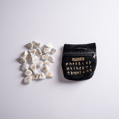 Rune with runes in luxurious black velvet bag, ready for spiritual rituals.