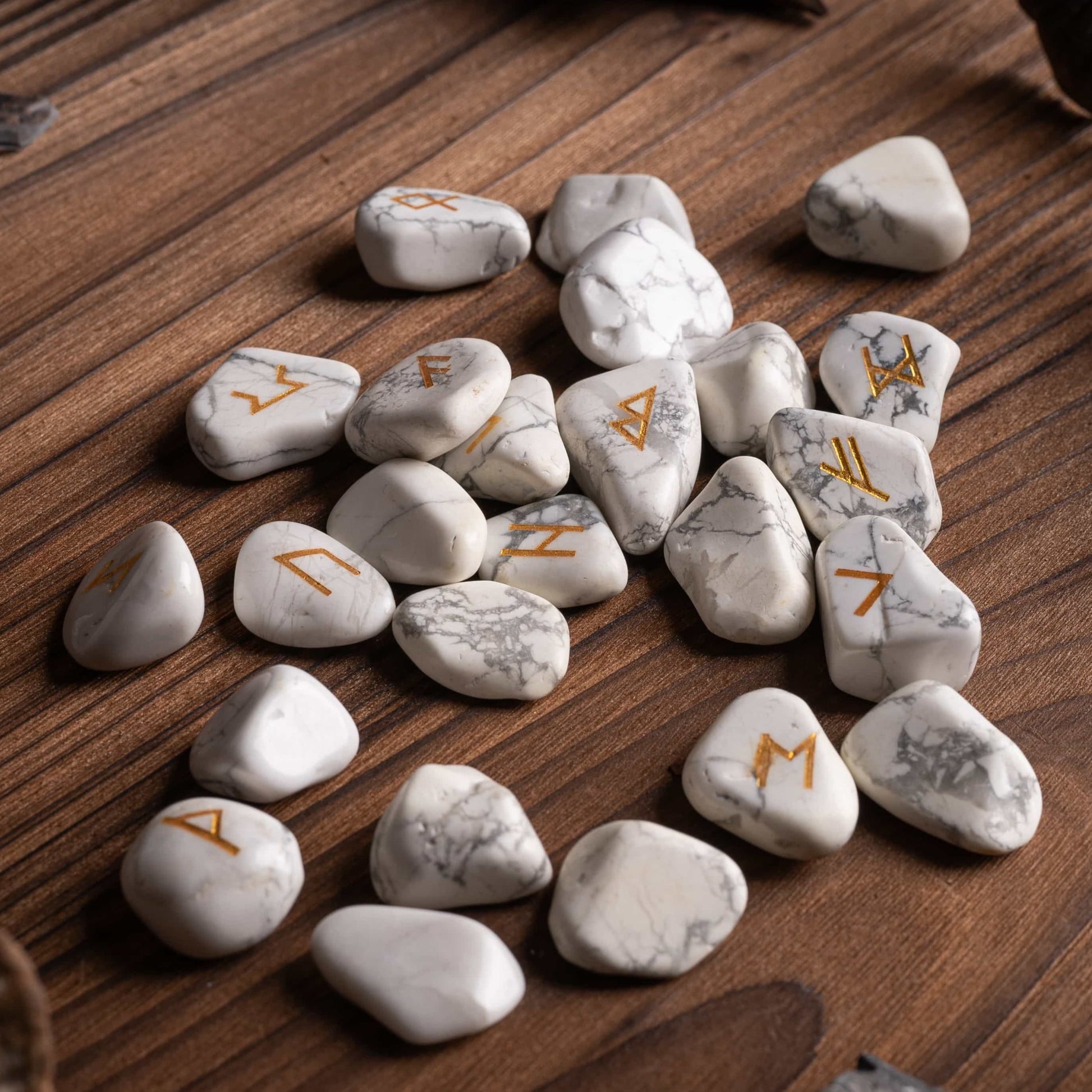Close-up of runes crystal showing engraved glyphs on white turquoise.