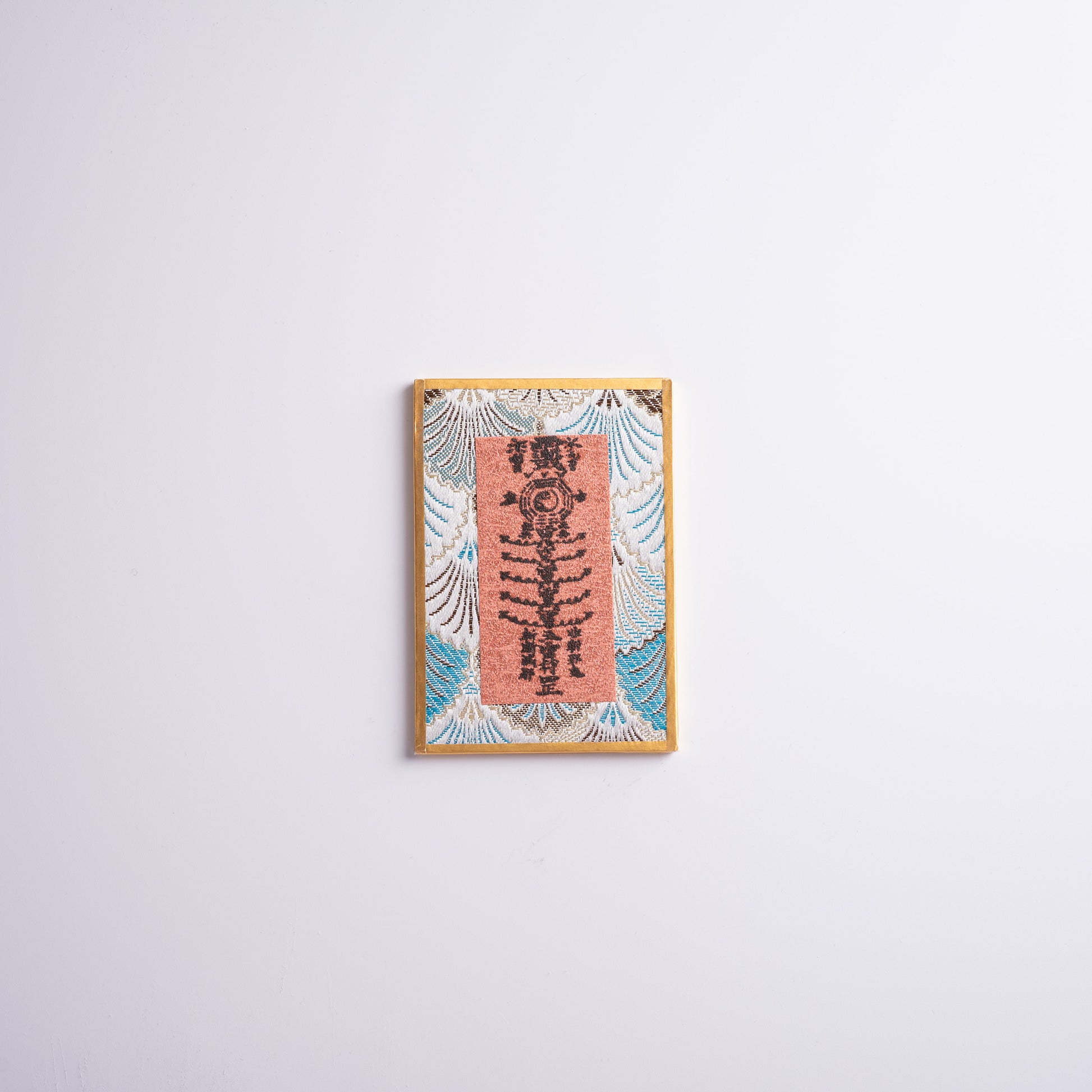 Talisman hope charm placed on altar for meditation and spiritual protection.